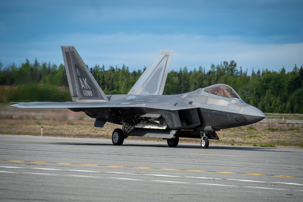 F-22 Raptors assigned to JBER conduct aerial maneuvers during exercise Tropic Tundra