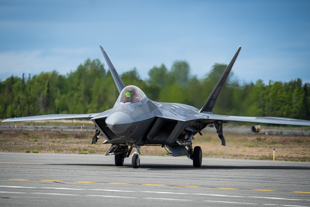 F-22 Raptors assigned to JBER conduct aerial maneuvers during exercise Tropic Tundra