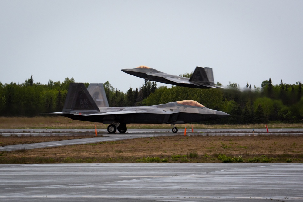 F-22 Raptors assigned to JBER conduct aerial maneuvers during exercise Tropic Tundra