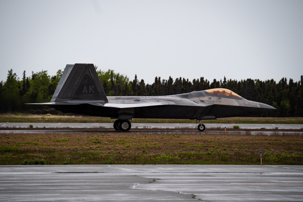F-22 Raptors assigned to JBER conduct aerial maneuvers during exercise Tropic Tundra