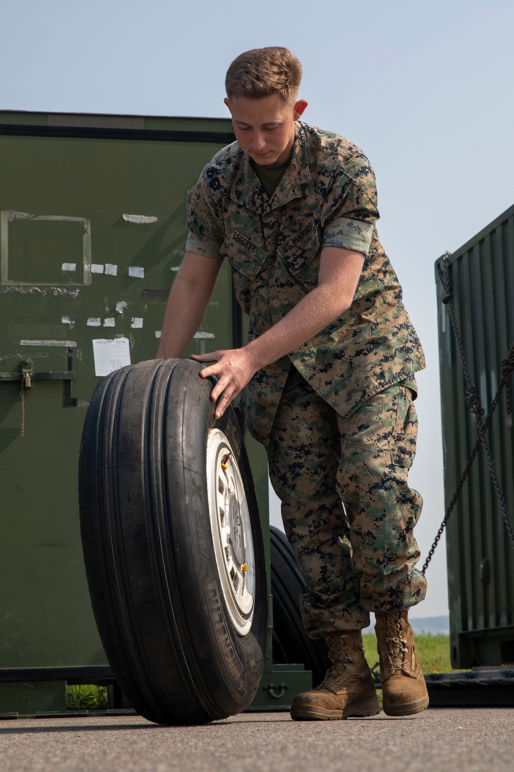 U.S. Marine inspects gear in Osan Air Base
