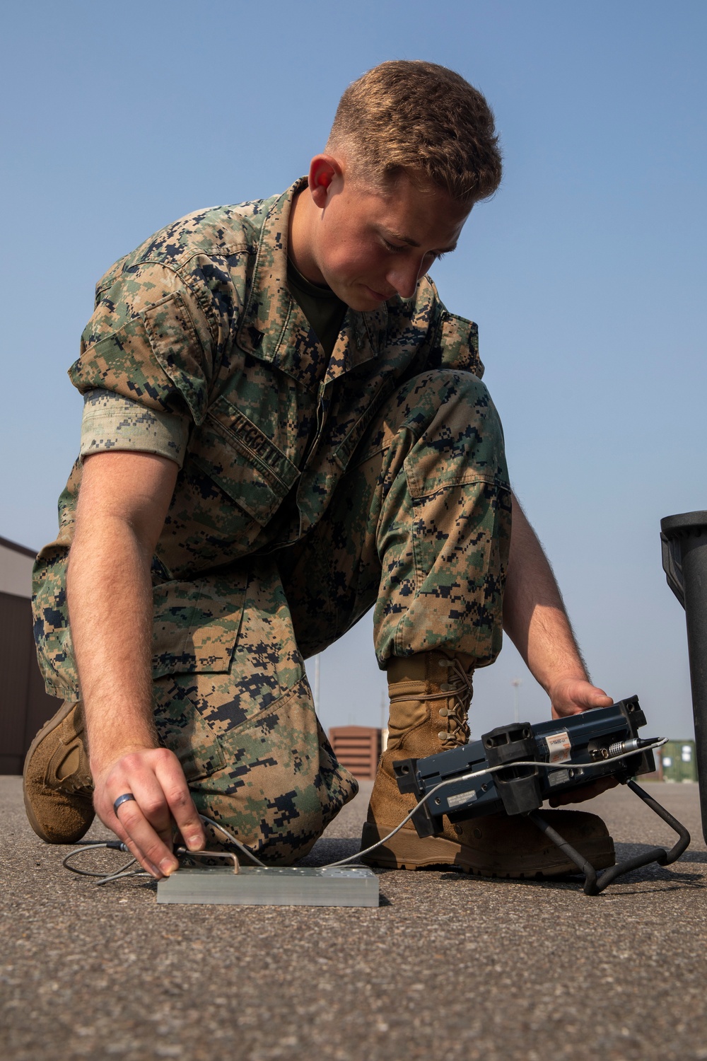 U.S. Marine inspects gear in Osan Air Base
