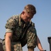 U.S. Marine inspects gear in Osan Air Base