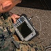 U.S. Marine inspects gear in Osan Air Base