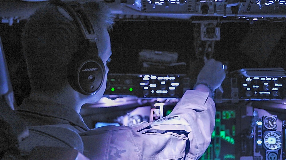 U.S. Navy, 909th ARS perform night training over the Pacific