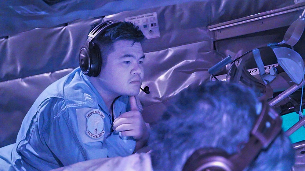 U.S. Navy, 909th ARS perform night training over the Pacific