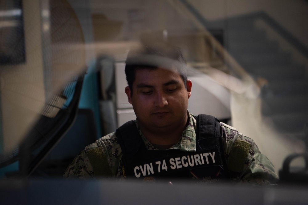 USS John C. Stennis (CVN 74) Sailor mans Security Desk