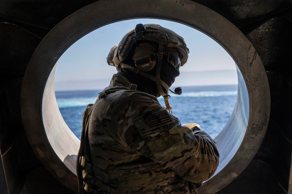 USS Charleston (LCS-18) conducts small boat operations with U.S. Coast Guard