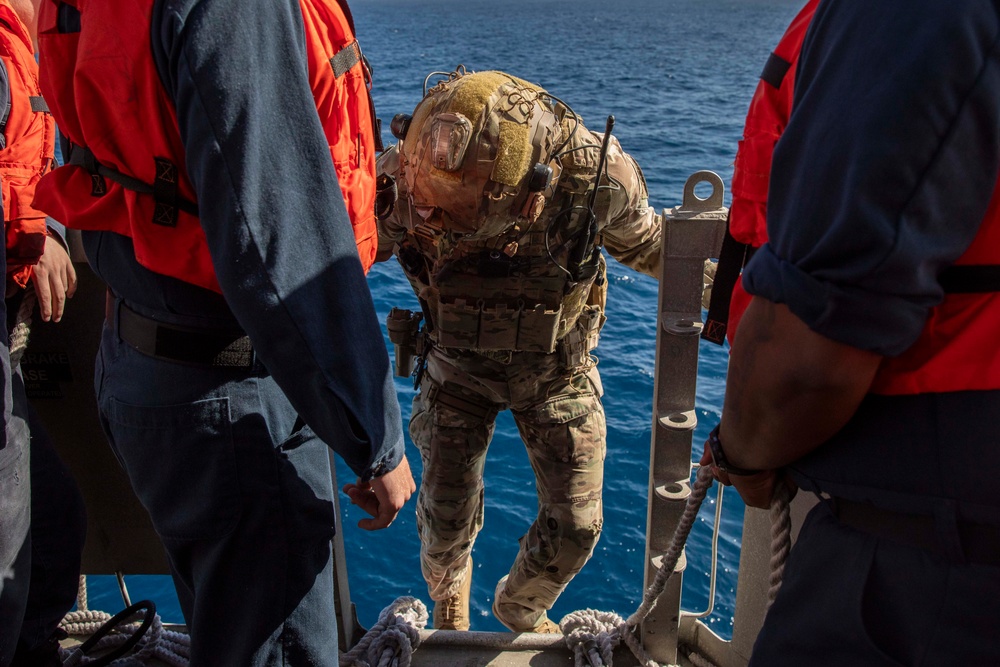 USS Charleston (LCS-18) conducts small boat operations with U.S. Coast Guard