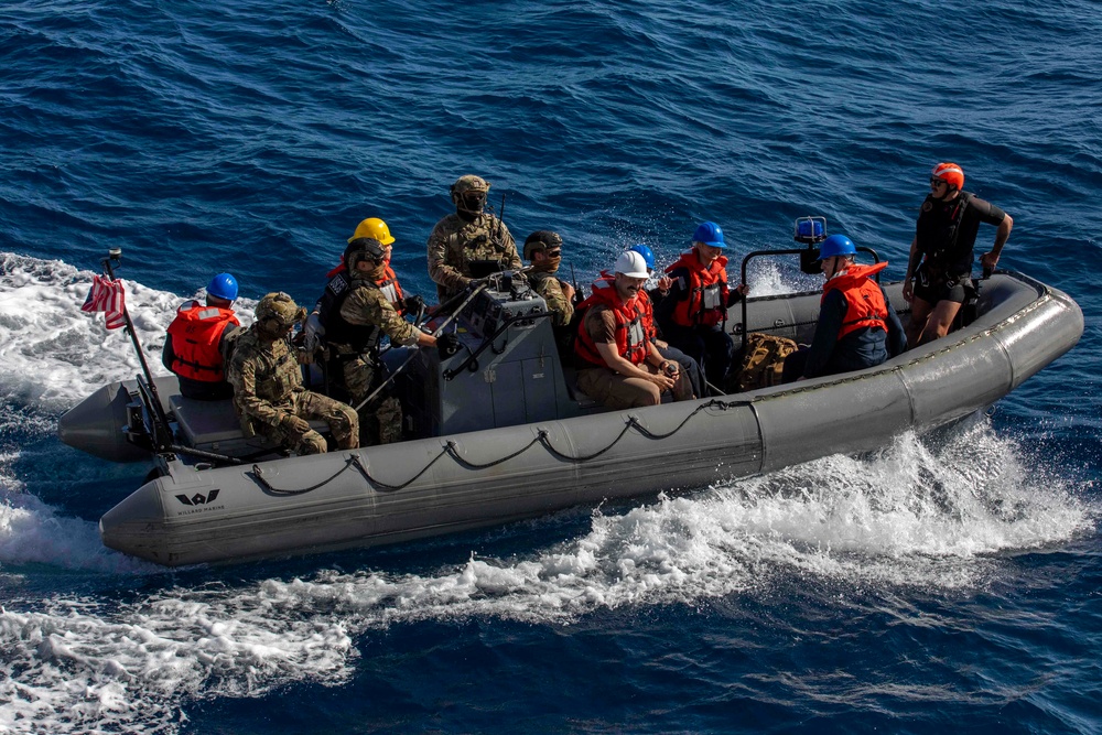 USS Charleston (LCS-18) conducts small boat operations with U.S. Coast Guard