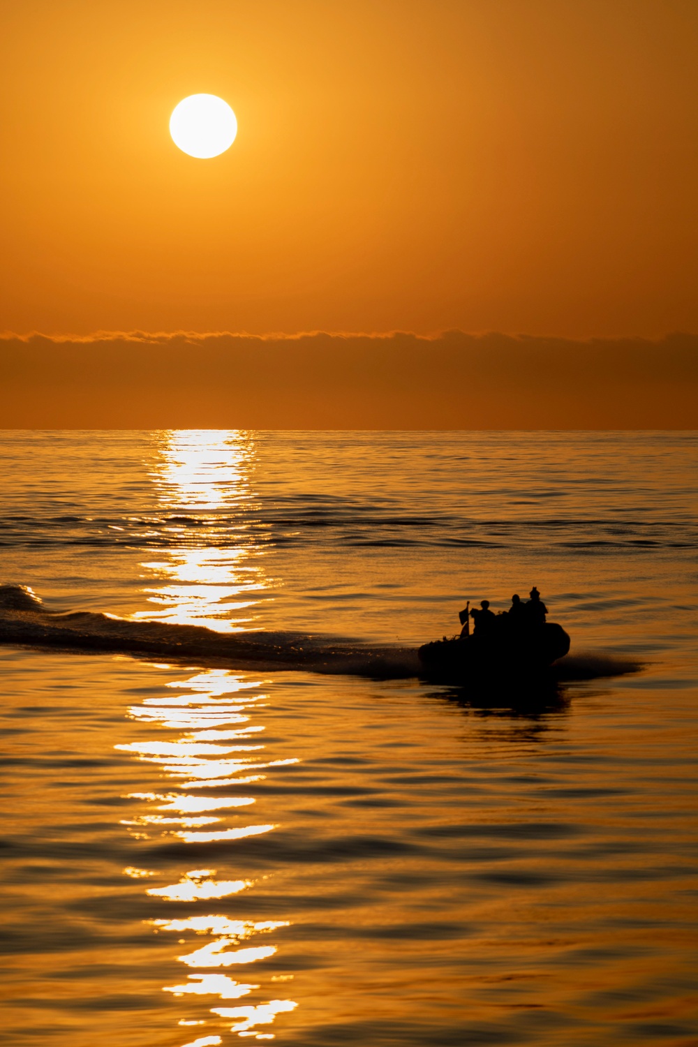 USS Charleston (LCS-18) conducts small boat operations with U.S. Coast Guard