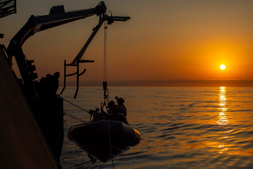 USS Charleston (LCS-18) conducts small boat operations with U.S. Coast Guard