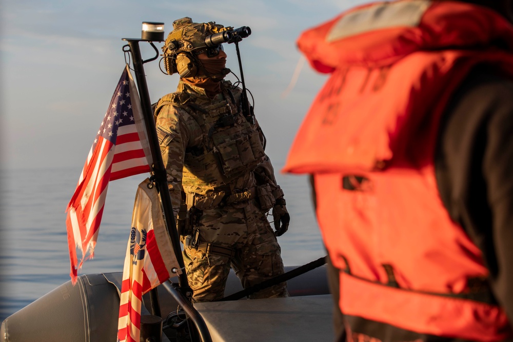 USS Charleston (LCS-18) conducts small boat operations with U.S. Coast Guard