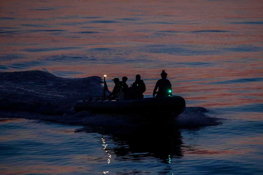USS Charleston (LCS-18) conducts small boat operations with U.S. Coast Guard
