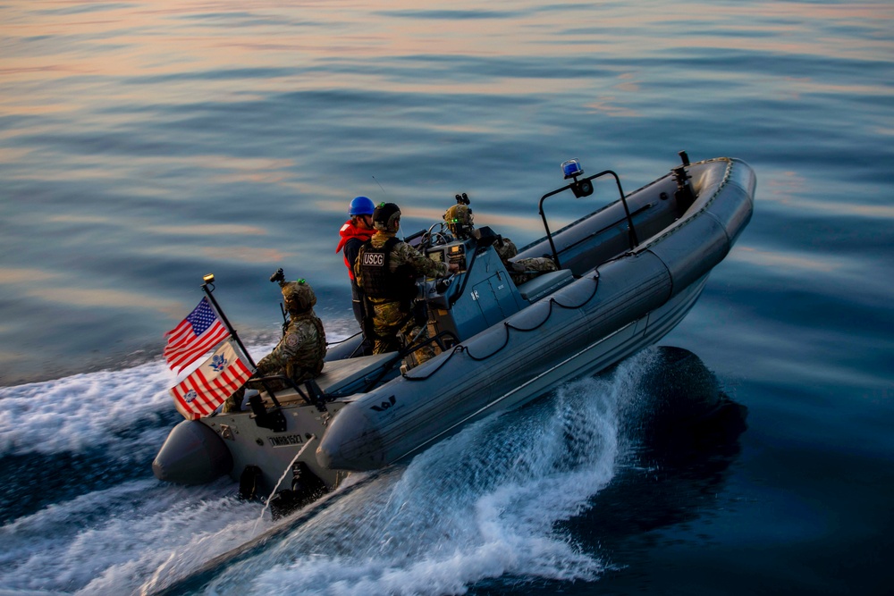 USS Charleston (LCS-18) conducts small boat operations with U.S. Coast Guard