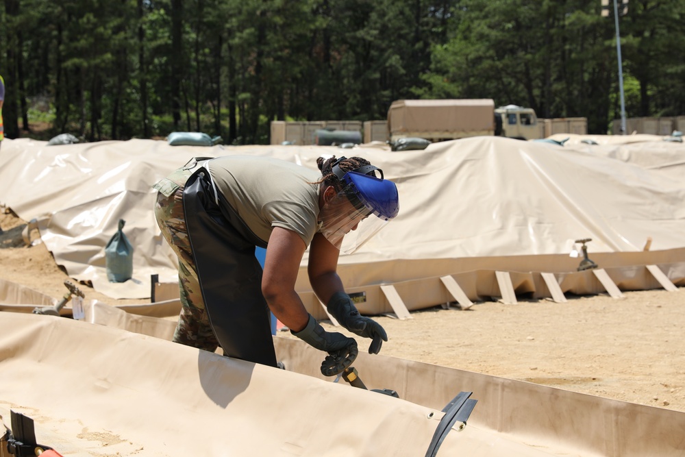233rd Quartermaster Company Fuel System Supply Point receives fuel from the 223rd Transportation Company at QLLEX