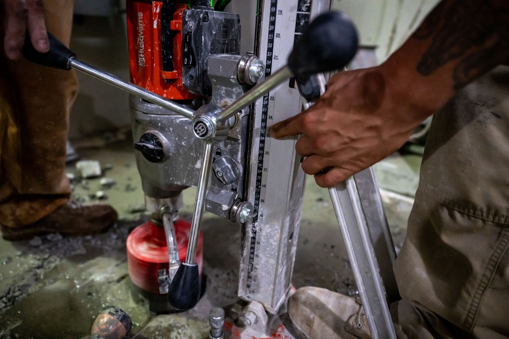 Securing the Runway: Heavy Equipment Operators Remove Bolts in Critical Overhaul