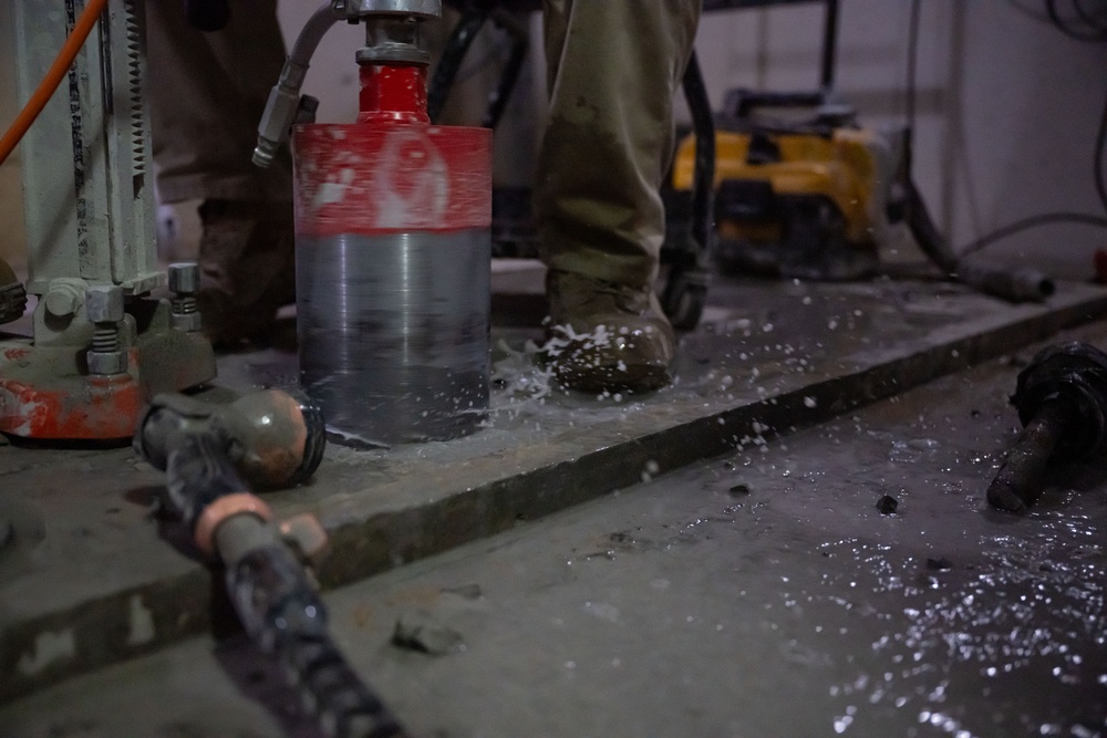 Securing the Runway: Heavy Equipment Operators Remove Bolts in Critical Overhaul