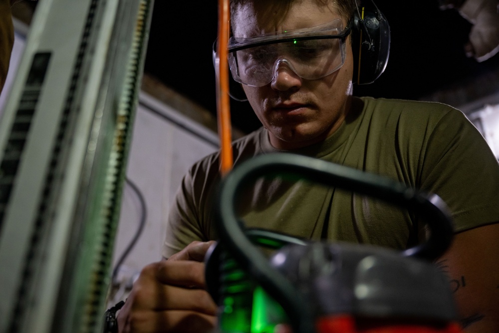 Securing the Runway: Heavy Equipment Operators Remove Bolts in Critical Overhaul