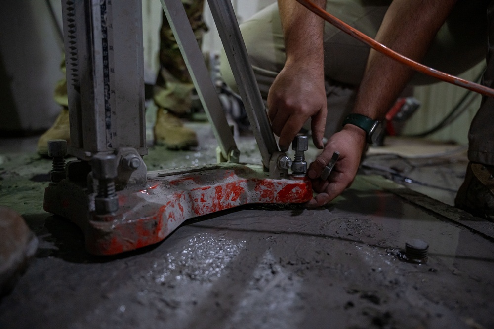 Securing the Runway: Heavy Equipment Operators Remove Bolts in Critical Overhaul