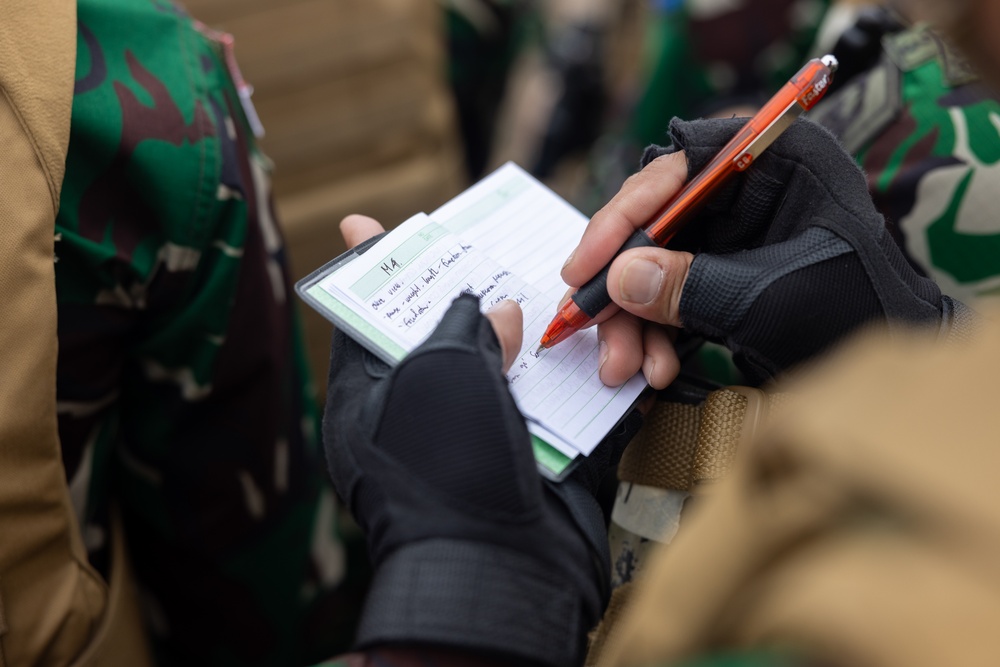 U.S. Marines teach members of Indonesian Korps Marinir about M4 carbine