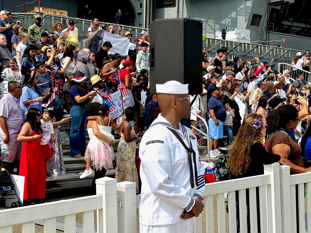 The U.S. Fleet Forces band heralds the return of the USS Harry S. Truman (CVN 75)