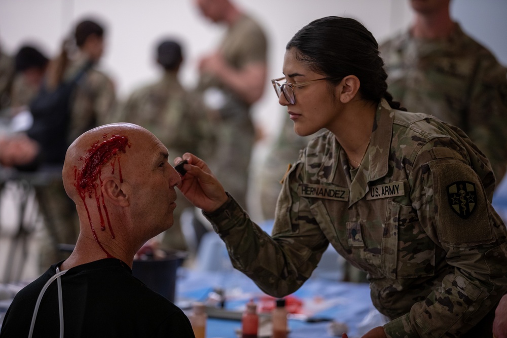 Brig. Gen. Todd Traver goes hands-on as notional casualty during medical unit visits