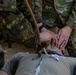 Soldiers run through combat medic specialist training lanes during Exercise Global Medic