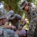Soldiers run through combat medic specialist training lanes during Exercise Global Medic