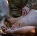 Soldiers run through combat medic specialist training lanes during Exercise Global Medic