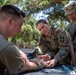 Soldiers run through combat medic specialist training lanes during Exercise Global Medic