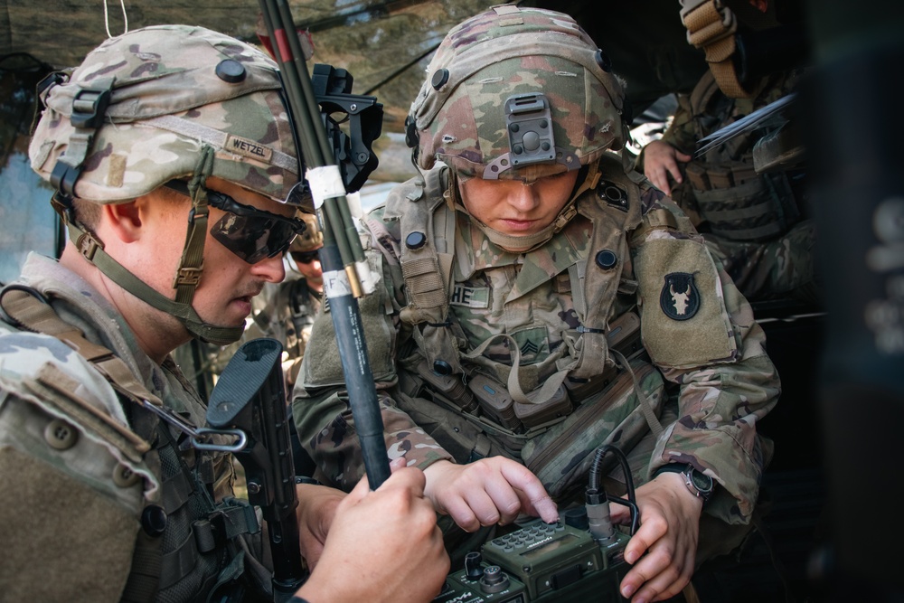 Iowa Army National Guard Soldiers prepare radio
