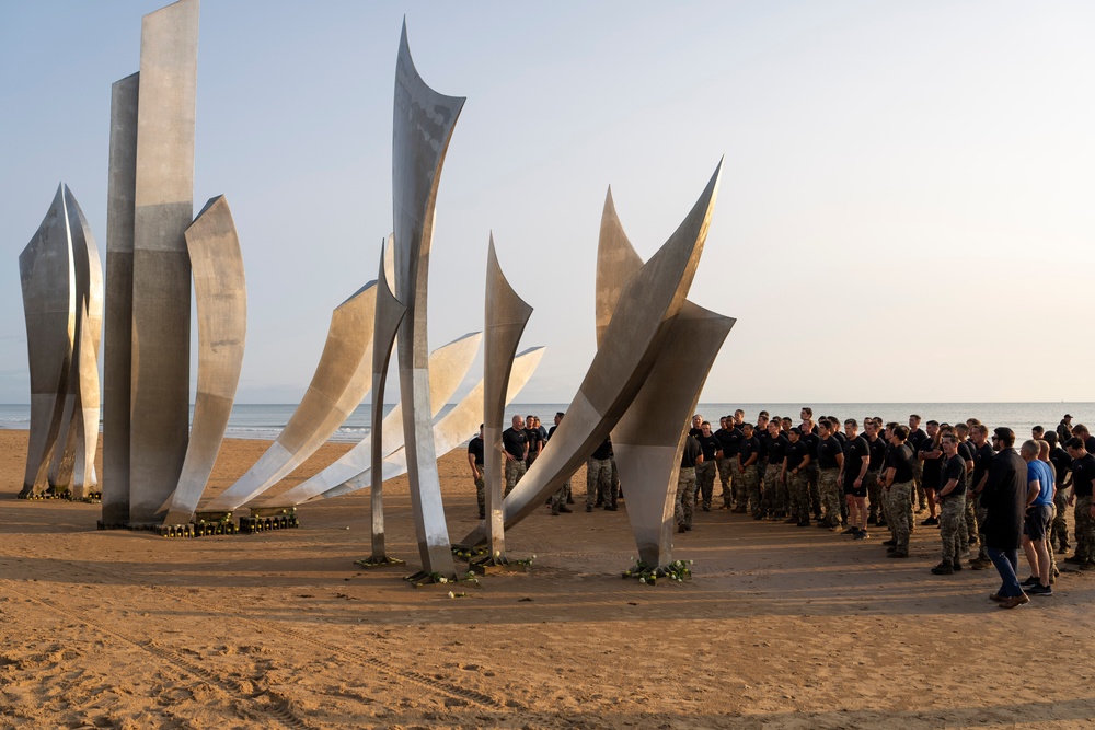 SD Participates in Troop PT on Omaha Beach, Meets with UK and French Counterparts, Delivers Remarks at D-Day Ceremonies
