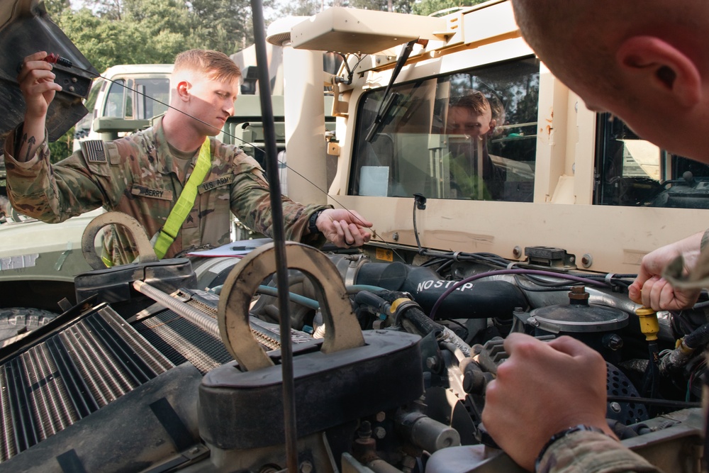 Iowa Army National Guard Soldiers conduct preventive maintenance checks and services