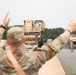 Iowa Army National Guard Soldier directs heavy machinery
