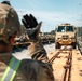 Iowa Army National Guard Soldier directs heavy machinery at JRTC
