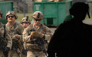Iowa Army National Guard Soldiers walk to dining facility at JRTC