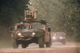 Iowa Army National Guard vehicles convoy to live-fire ranges at JRTC