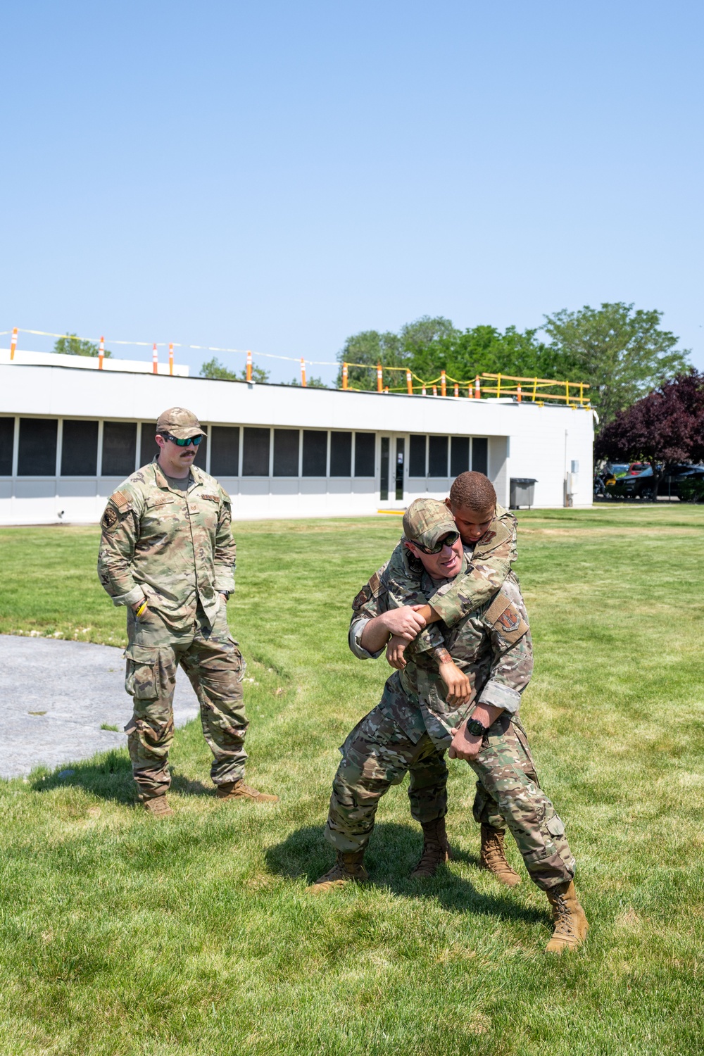 Master Sgt. Christopher Adams, assigned to the 152nd Operations Group, demonstrates a type of carry used when evacuating a patient from immediate danger