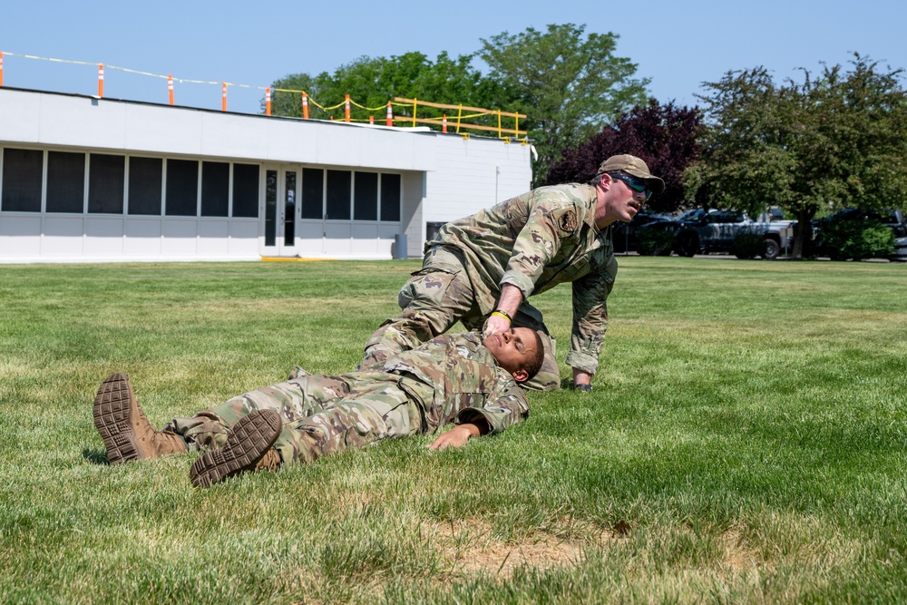 He Ain't Heavy, He's My Brother: Tech. Sgt. Joshua Adams, assigned to the 152nd Medical Group, demonstrates a type of drag used when evacuating a patient from immediate danger