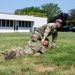 He Ain't Heavy, He's My Brother: Tech. Sgt. Joshua Adams, assigned to the 152nd Medical Group, demonstrates a type of drag used when evacuating a patient from immediate danger