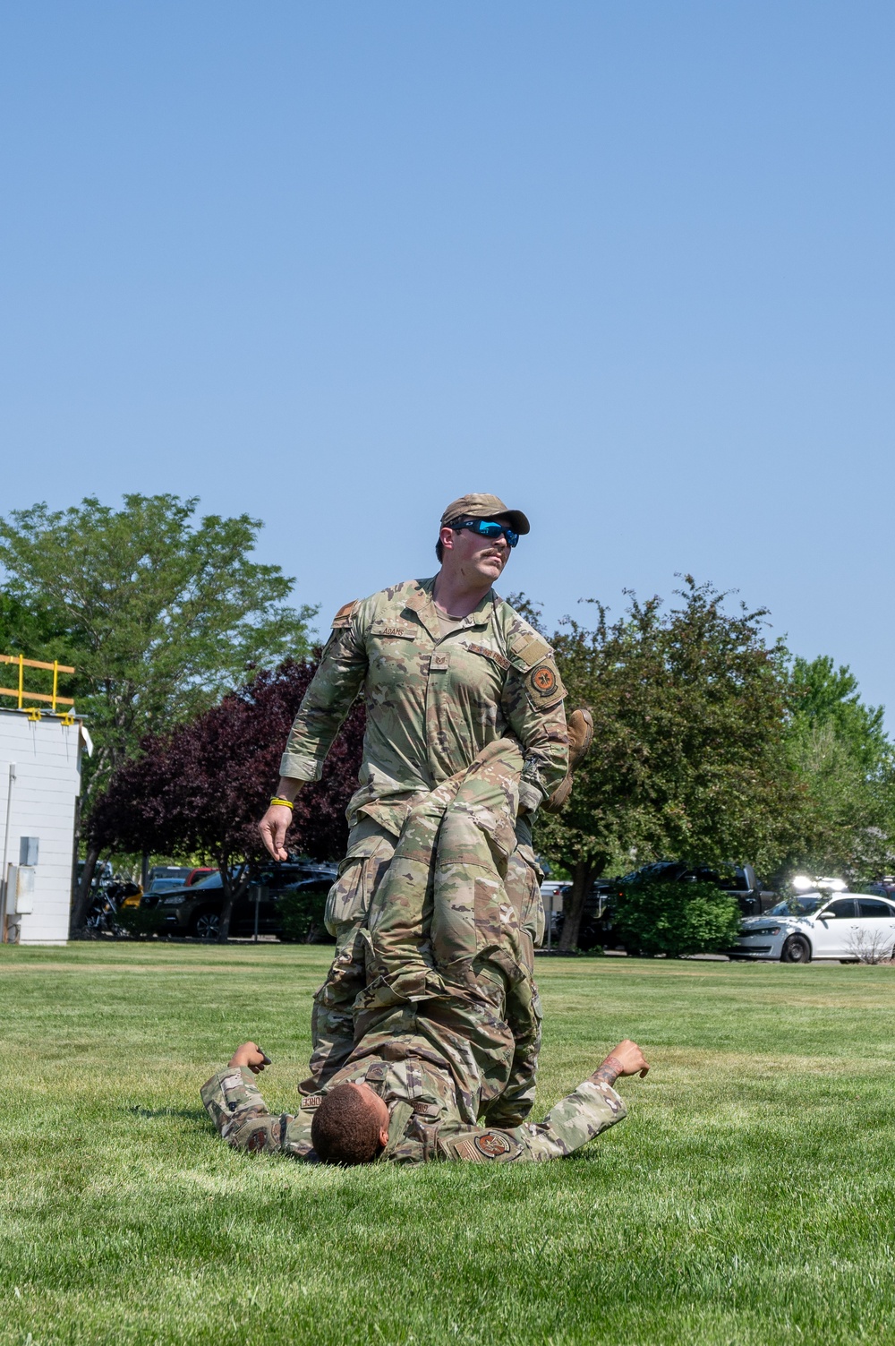 He Ain't Heavy, He's My Brother: Tech. Sgt. Joshua Adams, assigned to the 152nd Medical Group, demonstrates a type of drag used when evacuating a patient from immediate danger
