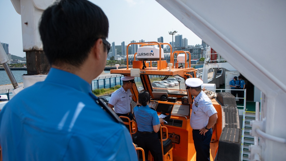 The Legend-class USCGC Stratton crew members receive a tour of Busan Coast Guard Station, Republic of Korea