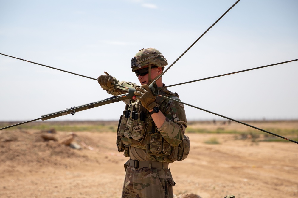 Coalition Forces Set Up Communications For Howitzer Sling Load Operation