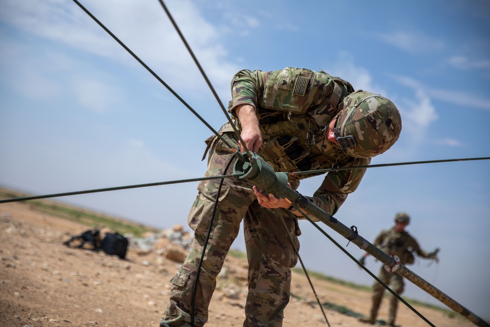 Coalition Forces Set Up Communications For Howitzer Sling Load Operation