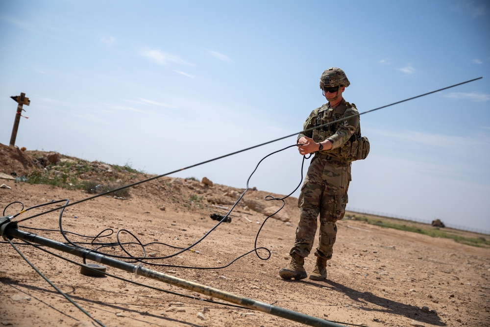 Coalition Forces Set Up Communications For Howitzer Sling Load Operation