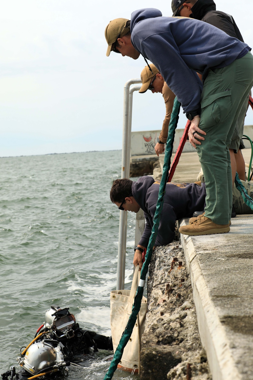 U.S. Navy Divers, Latvian Divers Remove Pylons During BALTOPS 25
