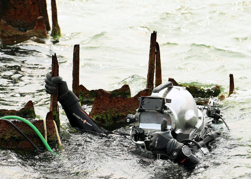 U.S. Navy Divers, Latvian Divers Remove Pylons During BALTOPS 25