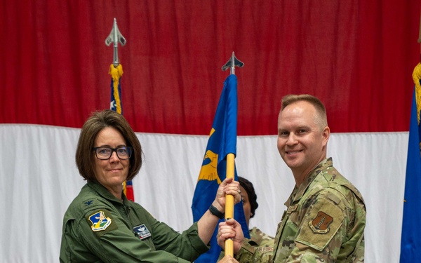 Chief Master Sgt. Jeffrey Linton, 152nd Airlift Wing Command Chief, passes the guidon for the final time to Col. Catherine Grush, Commander, 152nd Airlift Wing