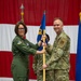 Chief Master Sgt. Jeffrey Linton, 152nd Airlift Wing Command Chief, passes the guidon for the final time to Col. Catherine Grush, Commander, 152nd Airlift Wing